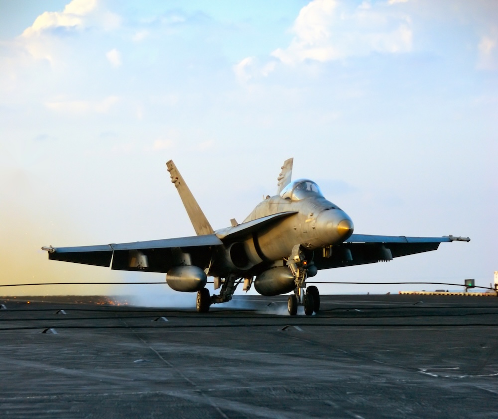 An,F-18,Hornet,Lands,Aboard,An,Aircraft,Carrier
